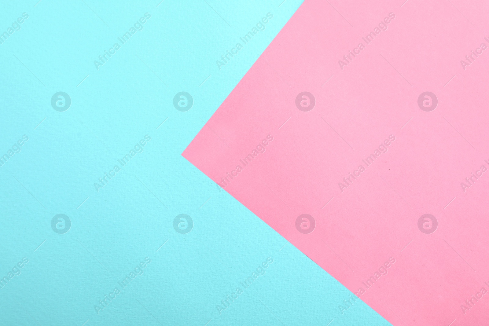 Photo of Blue and pink paper sheets as colorful background, top view