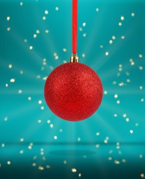 Beautiful red Christmas ball hanging on color background