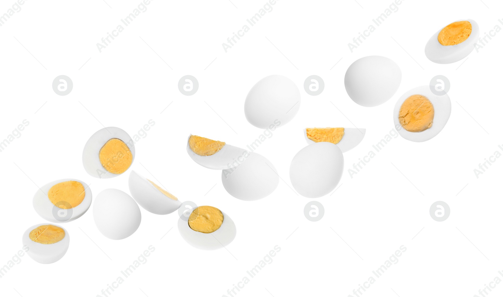 Image of Tasty hard boiled eggs falling on white background