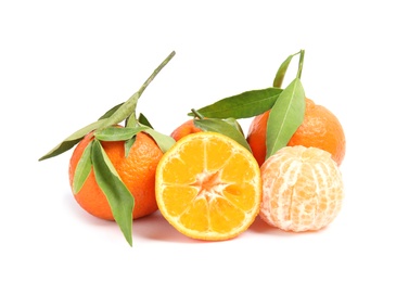 Photo of Tasty ripe tangerines with leaves on white background
