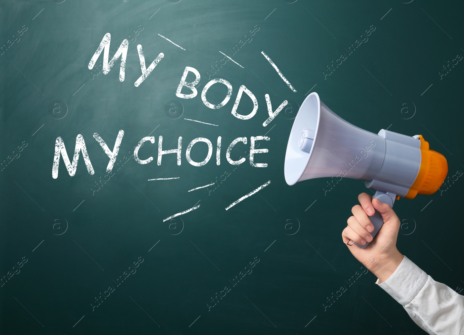 Image of Woman calling for keep abortion legal using megaphone, closeup. Slogan My Body My Choice on green chalkboard