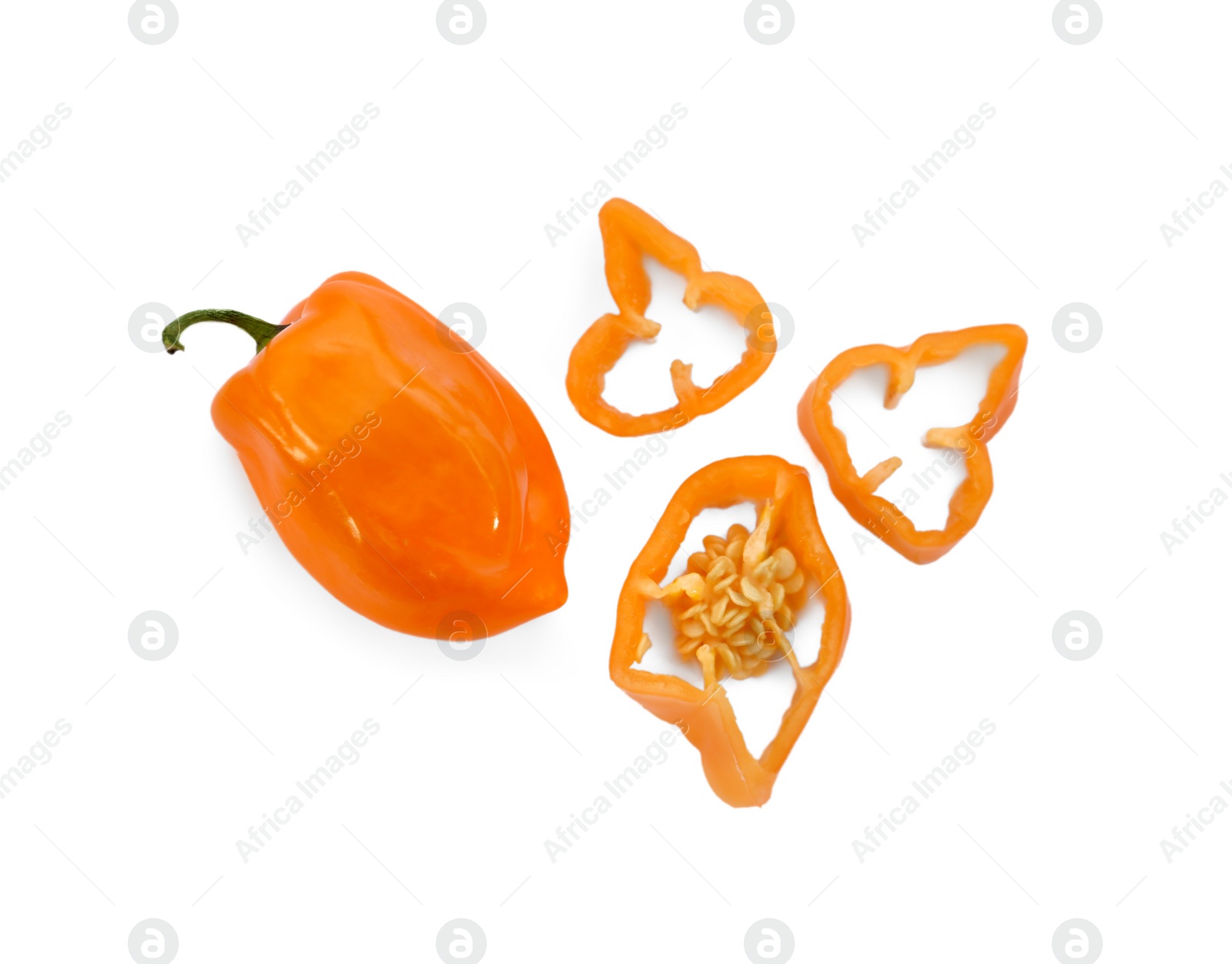 Photo of Whole and cut orange hot chili peppers on white background, flat lay