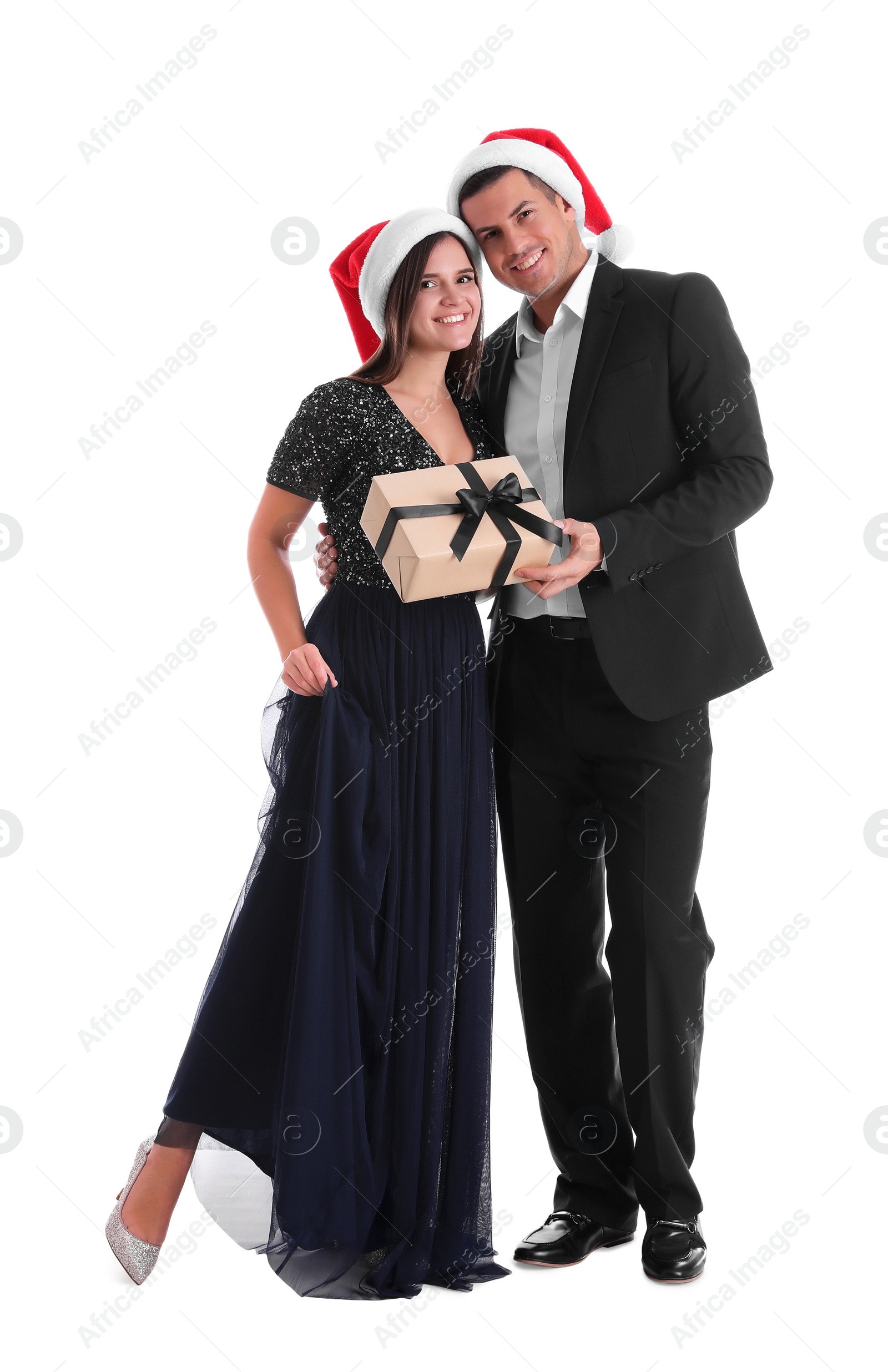 Photo of Man presenting Christmas gift to his girlfriend on white background