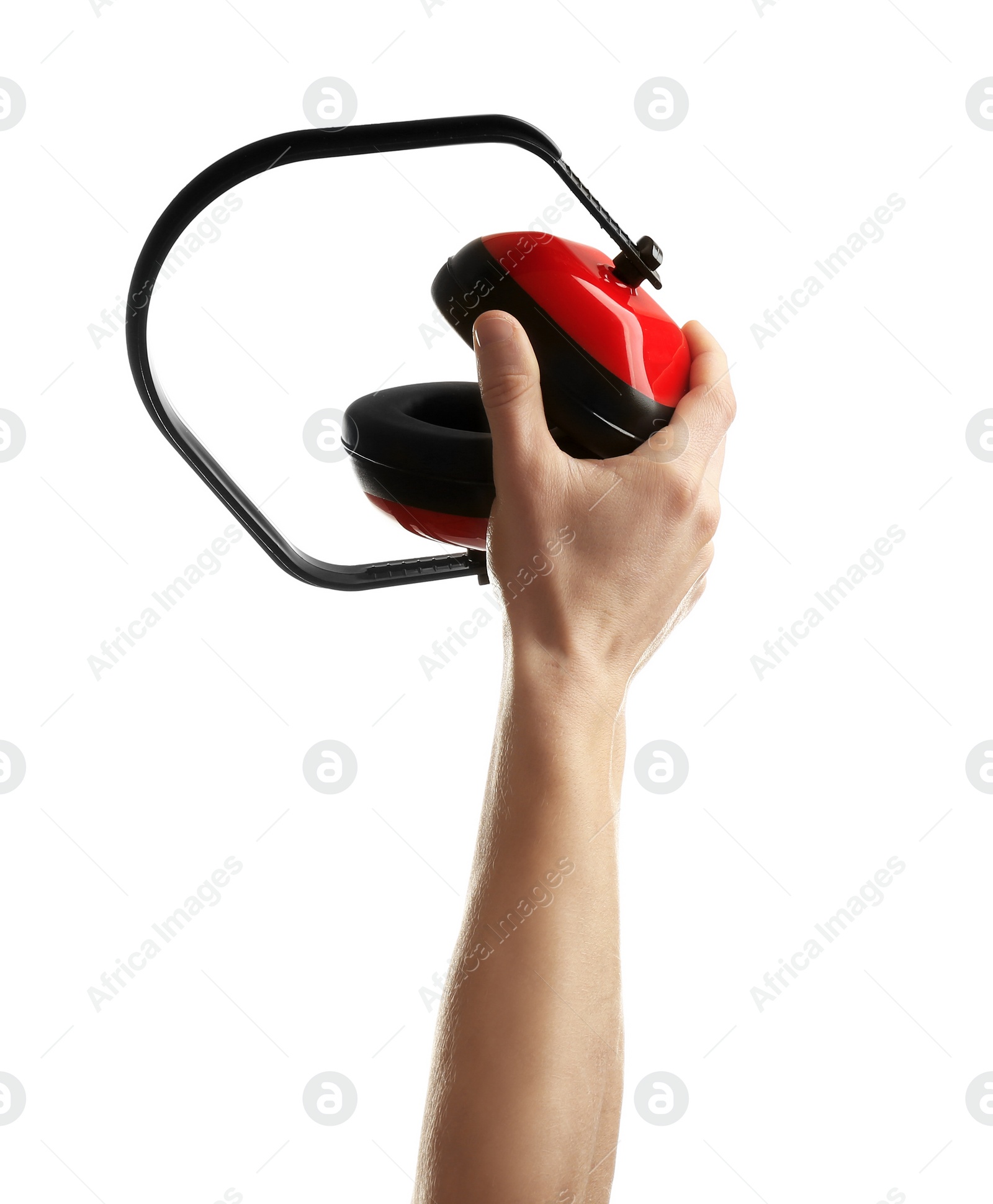 Photo of Man holding protective headphones on white background. Construction tools