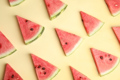 Slices of ripe watermelon on beige background, flat lay