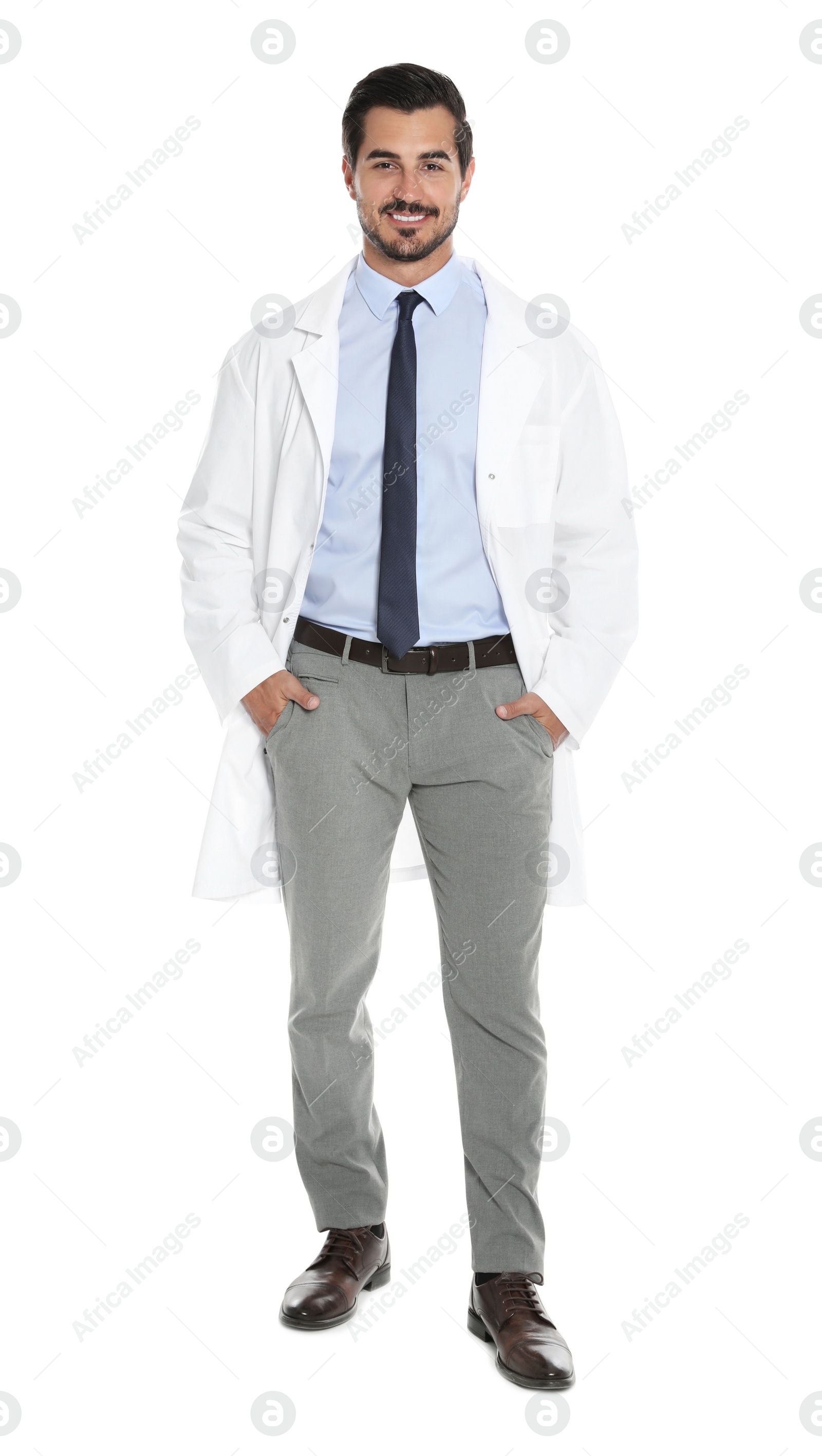 Photo of Full length portrait of young male doctor on white background. Medical service