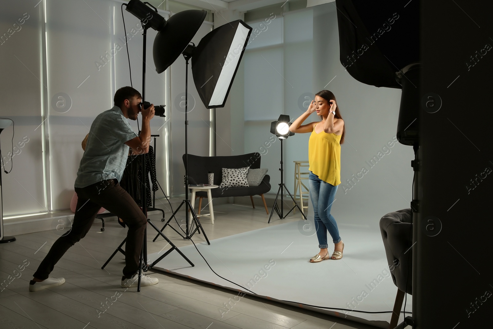 Photo of Beautiful model posing for professional photographer in studio