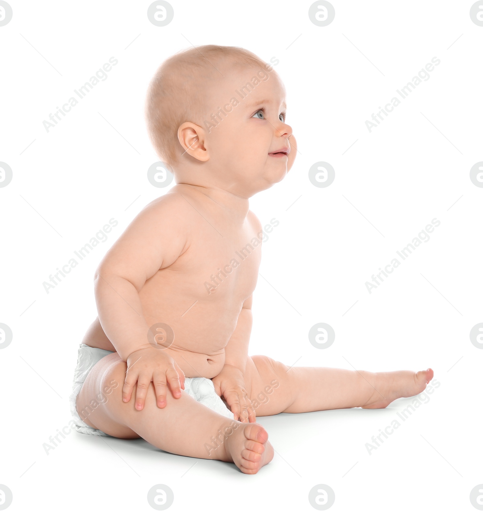 Photo of Cute little baby sitting on white background