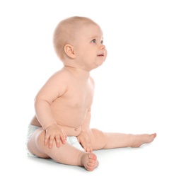 Photo of Cute little baby sitting on white background
