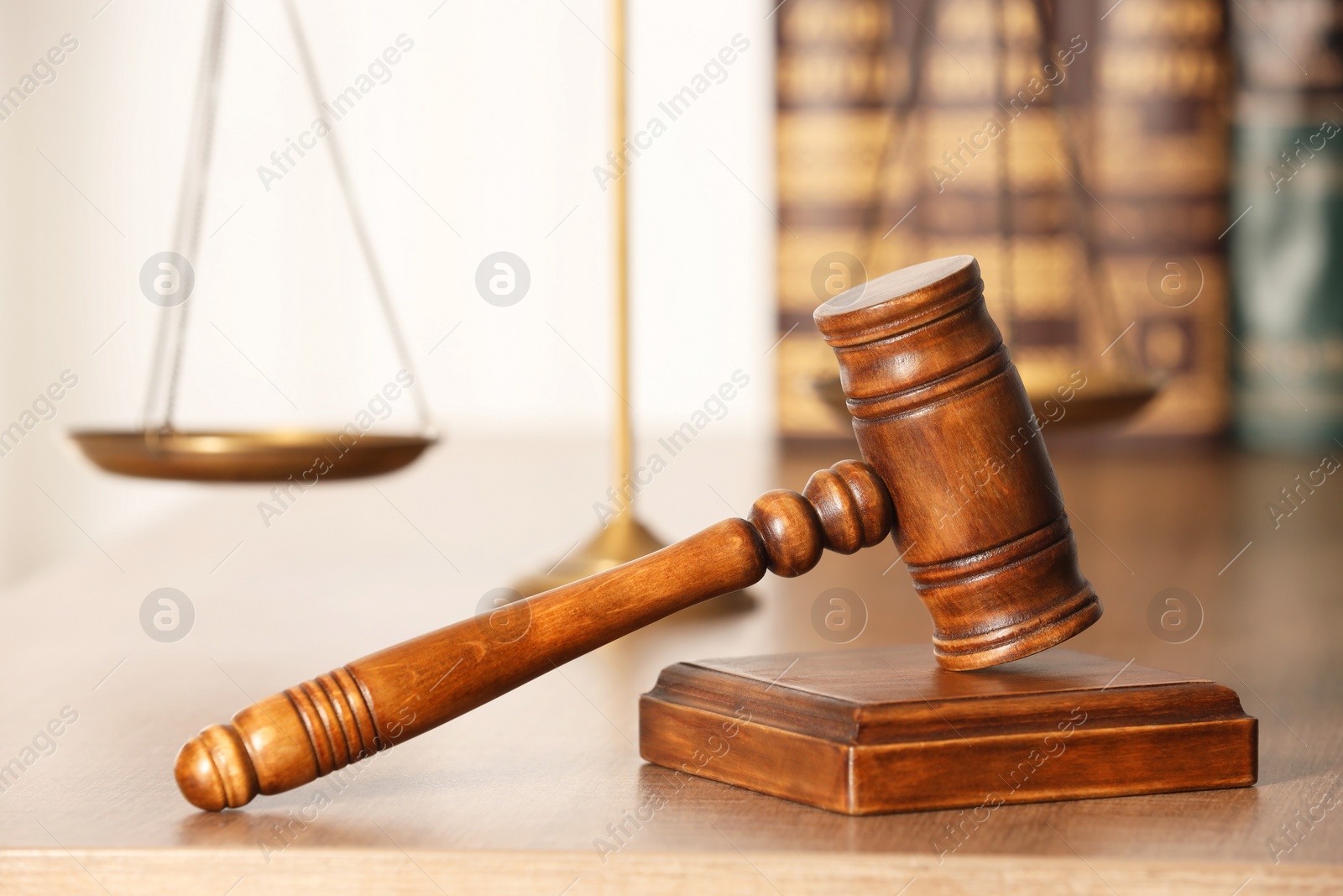 Photo of Law concept. Gavel on wooden table, closeup