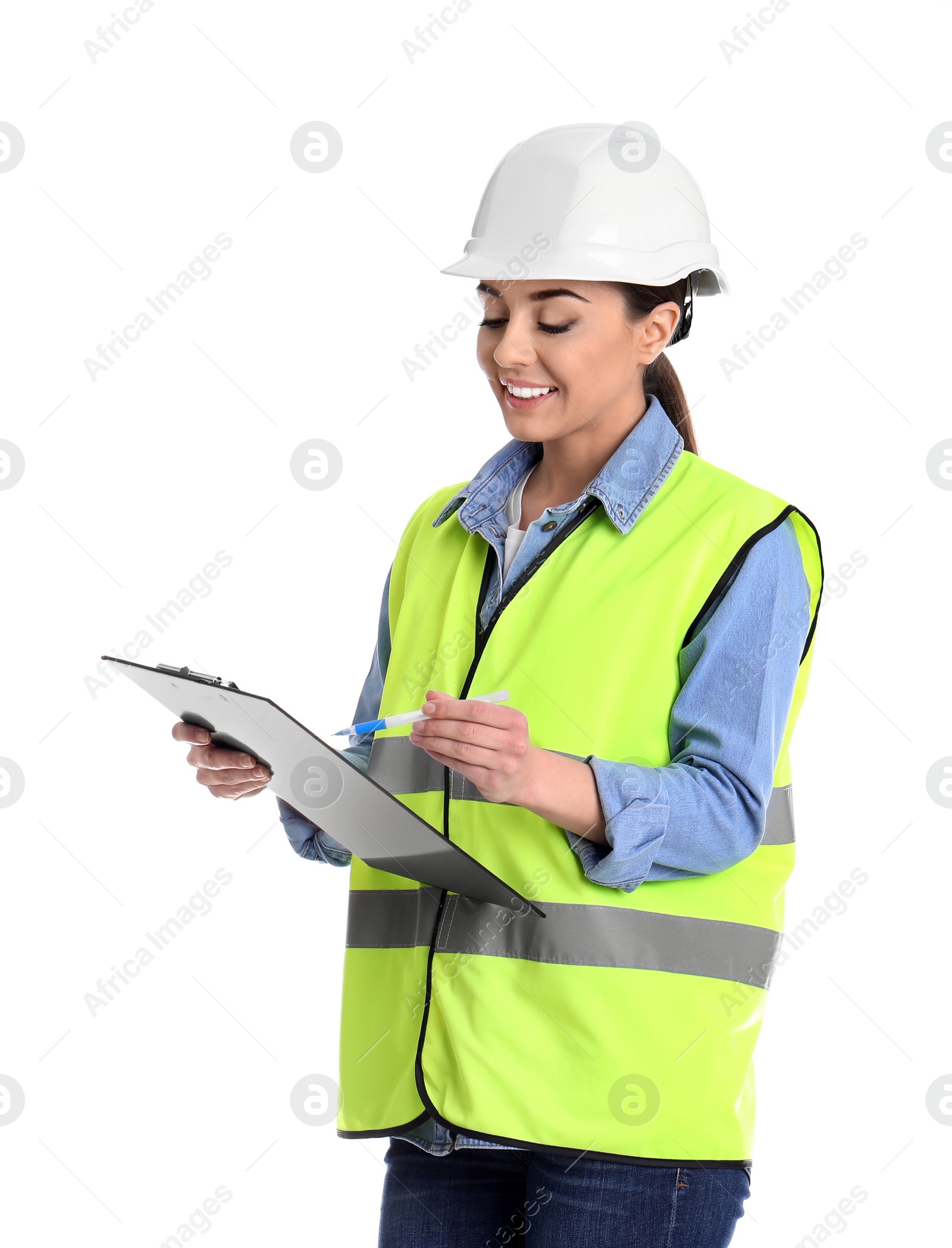 Photo of Female industrial engineer in uniform with clipboard on white background. Safety equipment