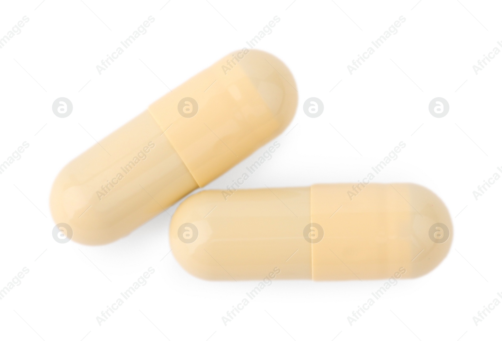 Photo of Vitamin capsules isolated on white, top view. Health supplements