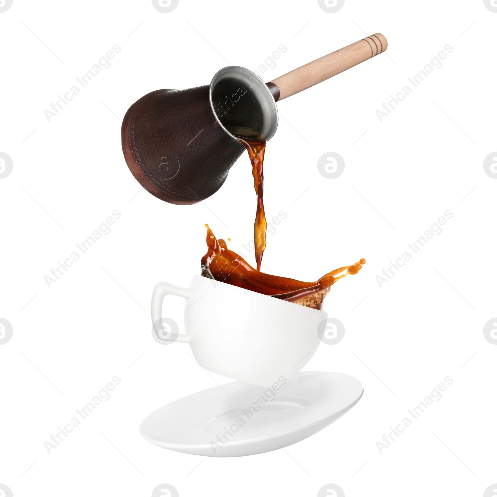 Image of Pouring freshly brewed aromatic coffee from turkish pot into cup. Objects in air on white background