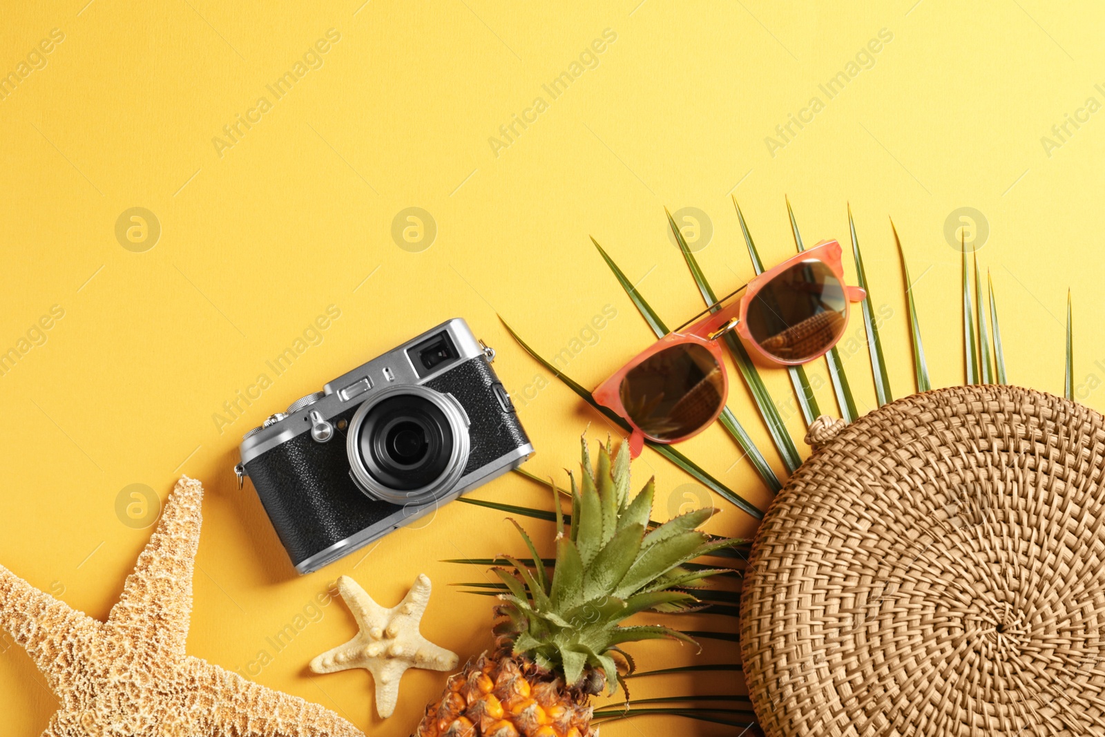 Photo of Flat lay composition with beach accessories on color background. Space for text