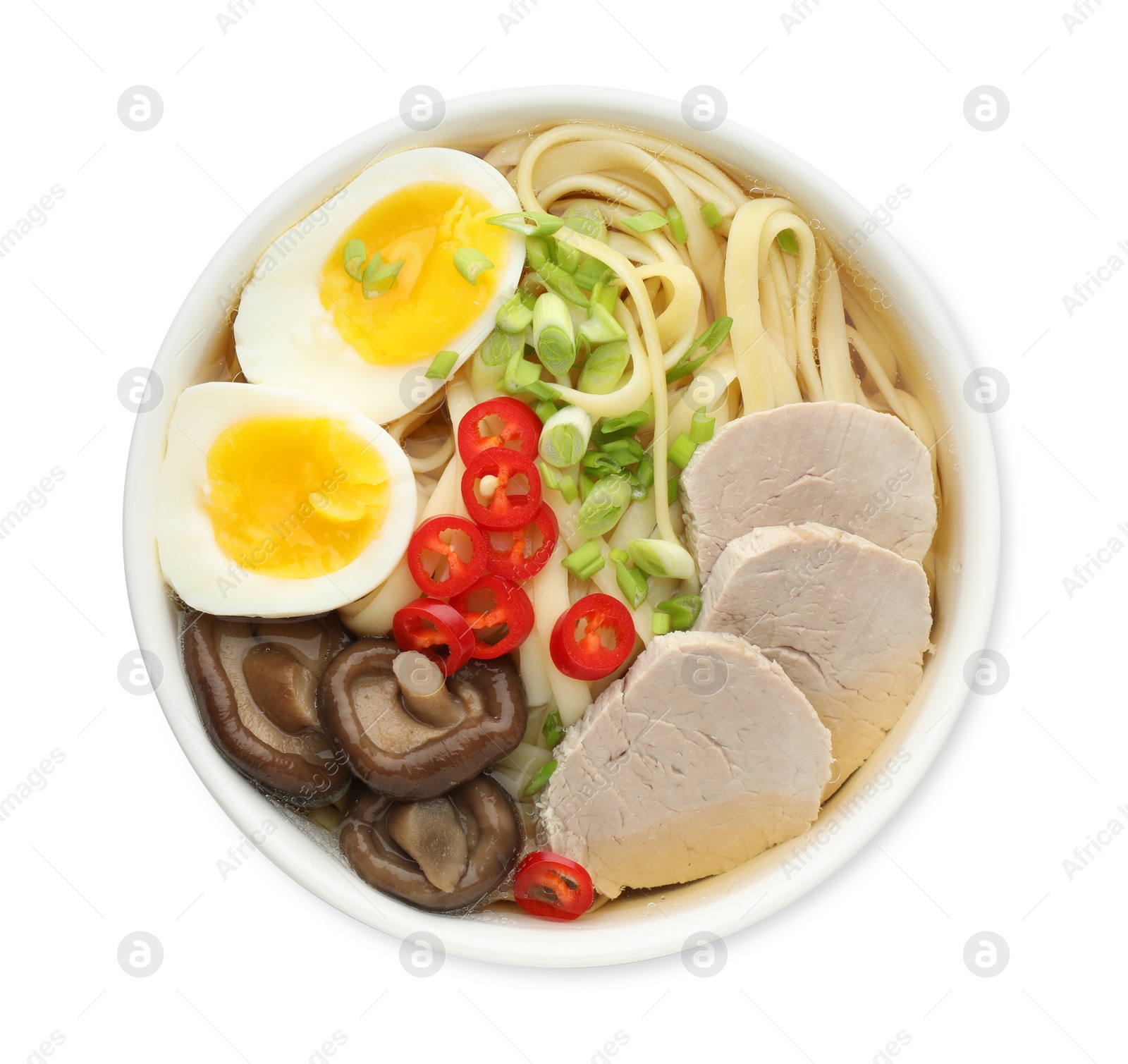 Photo of Delicious ramen with meat and eggs in bowl isolated on white, top view. Noodle soup