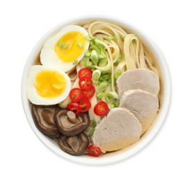 Photo of Delicious ramen with meat and eggs in bowl isolated on white, top view. Noodle soup