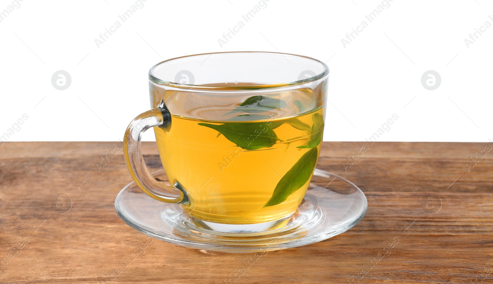 Photo of Refreshing green tea in cup on wooden table against white background