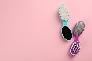 Photo of Pedicure tools with pumice stones on pink background, flat lay. Space for text