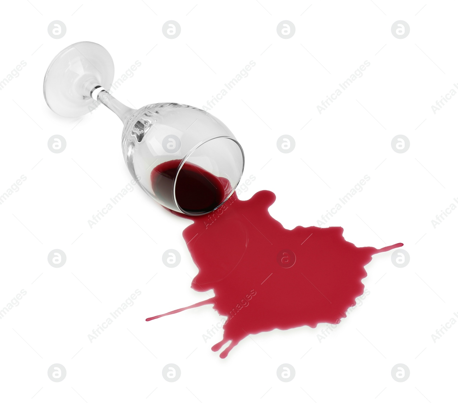 Photo of Overturned glass and spilled wine on white background