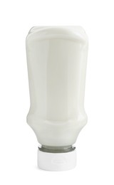 Photo of Fresh mayonnaise sauce in glass bottle isolated on white