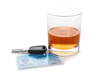 Photo of Glass of alcohol, car key and driver license on white background. Responsible driving concept