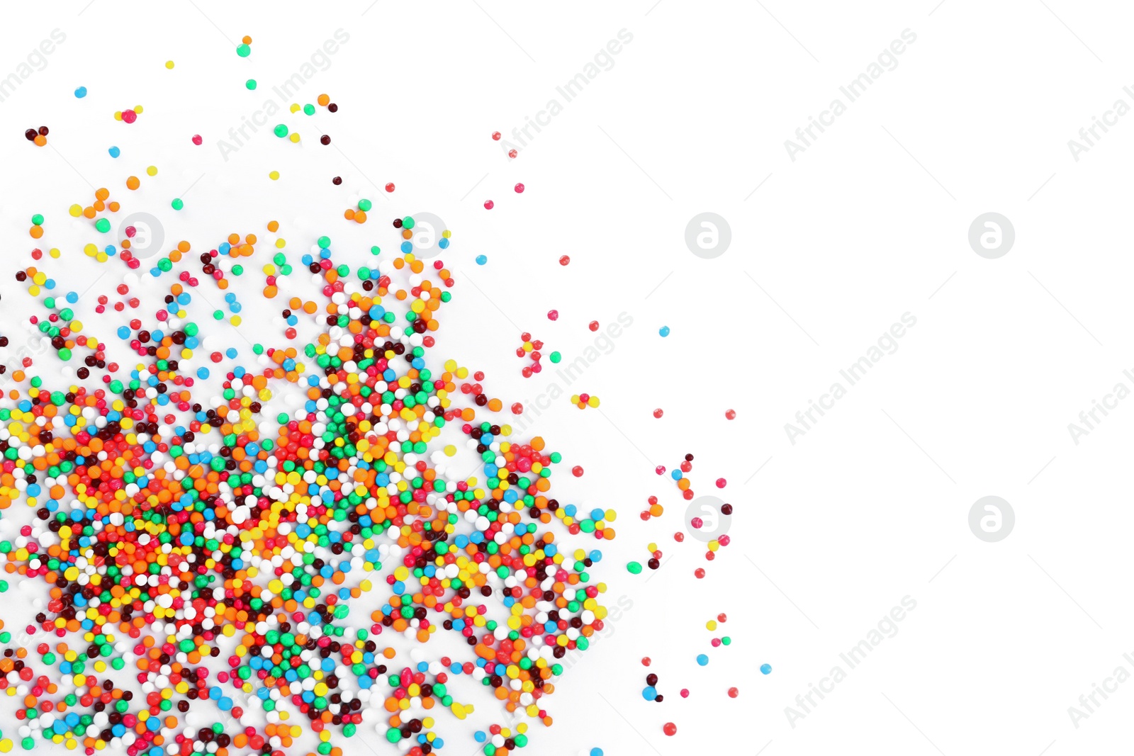 Photo of Colorful sprinkles on white background, top view. Confectionery decor