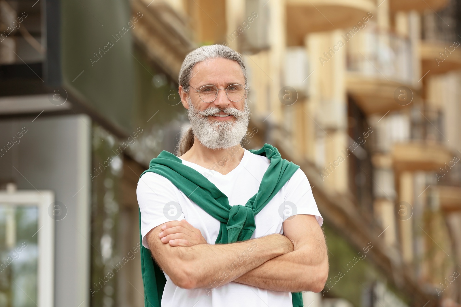 Photo of Portrait of handsome bearded mature man, outdoors