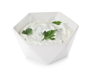 Photo of Bowl with sour cream and herbs on white background