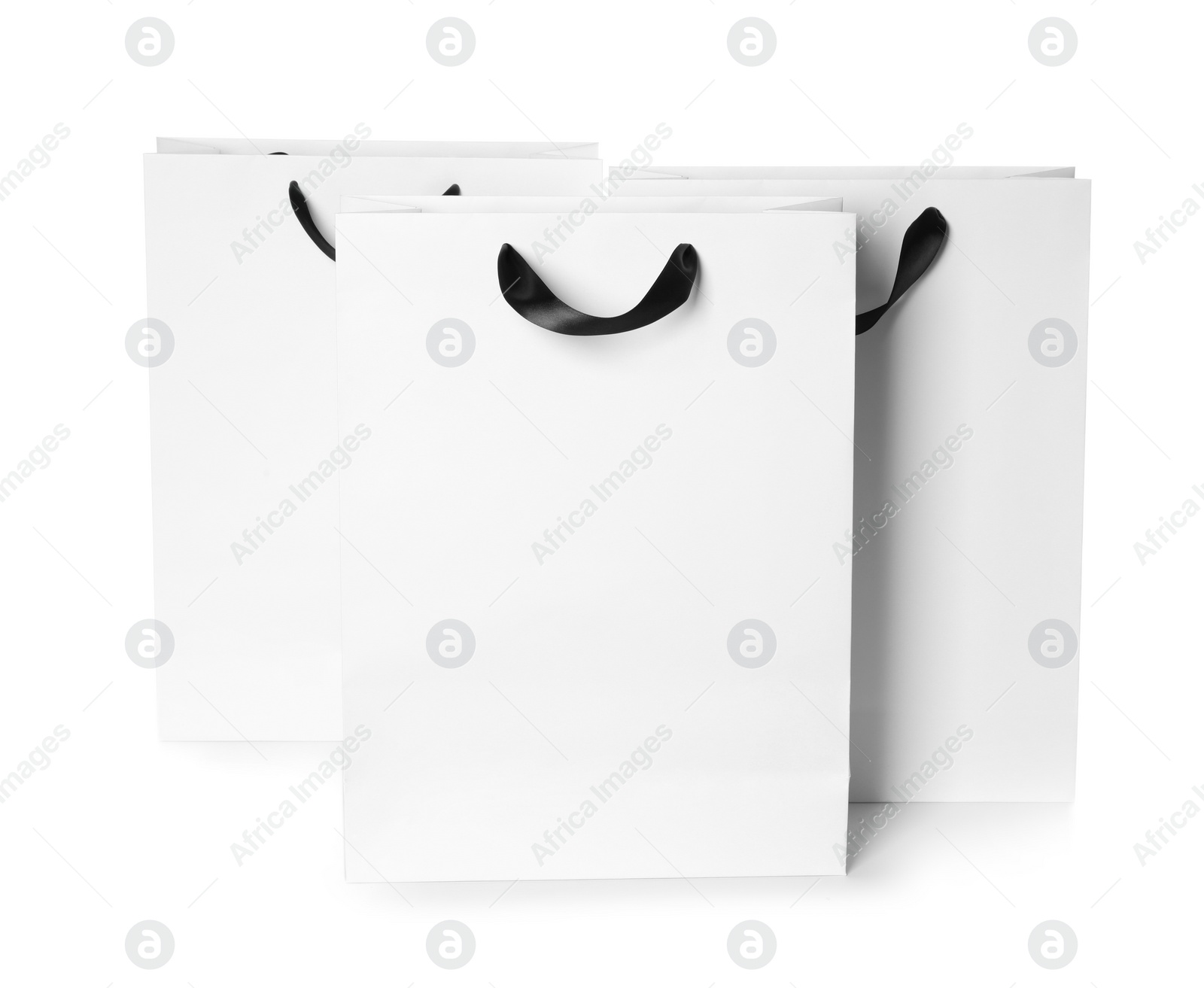 Photo of Paper shopping bags isolated on white. Mock up for design