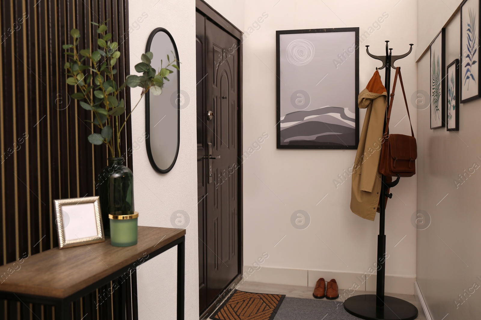 Photo of Modern hallway interior with stylish furniture and paintings