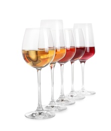 Row of glasses with different wines on white background