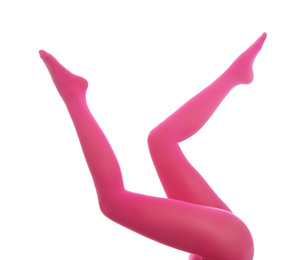 Woman wearing pink tights on white background, closeup of legs