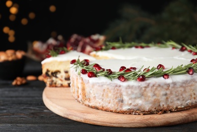 Traditional homemade Christmas cake on wooden table, closeup