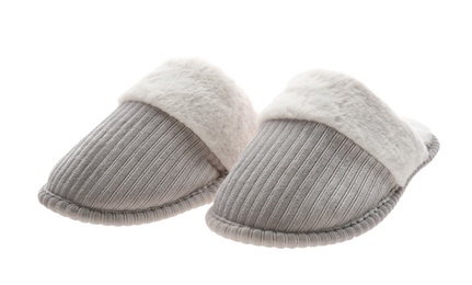 Photo of Pair of soft closed toe slippers on white background
