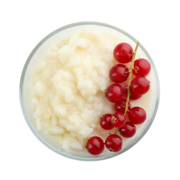 Photo of Delicious rice pudding with redcurrant isolated on white, top view