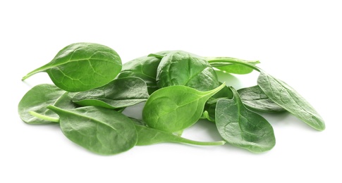 Pile of fresh green healthy baby spinach leaves on white background