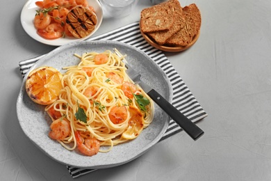Delicious pasta with shrimps on plate