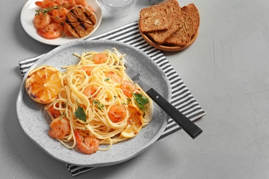 Photo of Delicious pasta with shrimps on plate