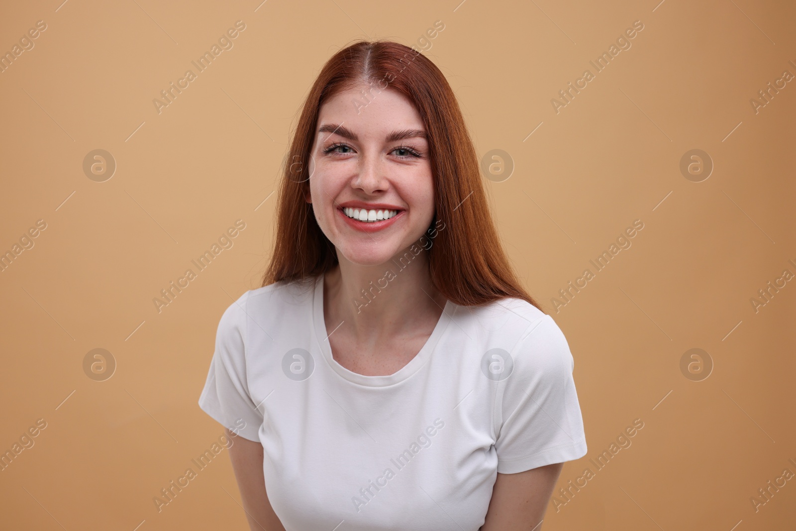 Photo of Portrait of smiling woman on beige background