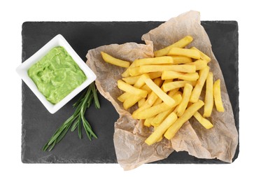 Photo of Serving board with delicious french fries, avocado dip and rosemary isolated on white, top view