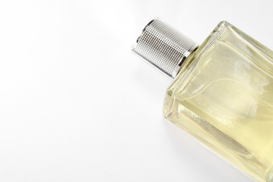 Luxury men`s perfume in bottle on white background, space for text