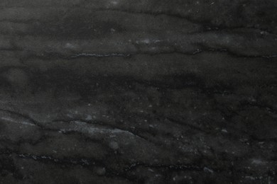 Photo of Black marble surface as background, closeup view