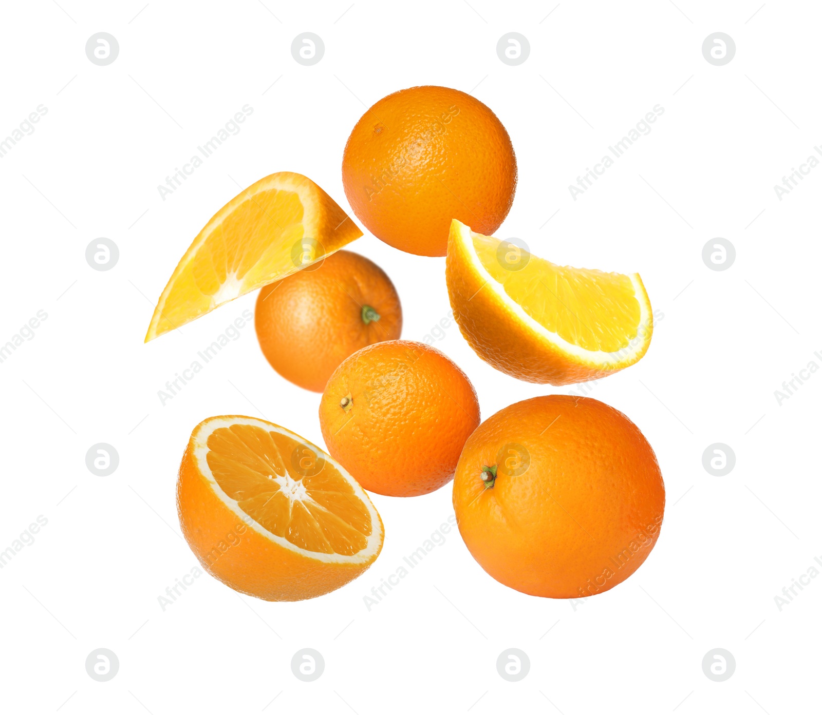 Image of Cut and whole oranges flying on white background