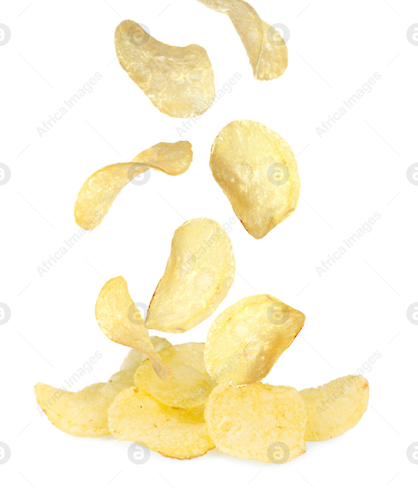 Image of Fried crispy potato chips falling into heap on white background