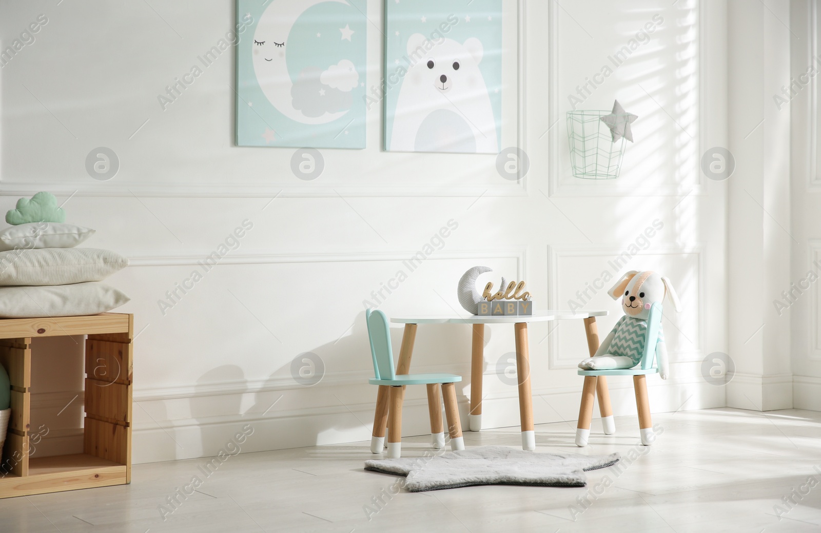 Photo of Baby room interior with stylish furniture and toys