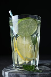 Photo of Delicious lemonade made with soda water and fresh mint on board