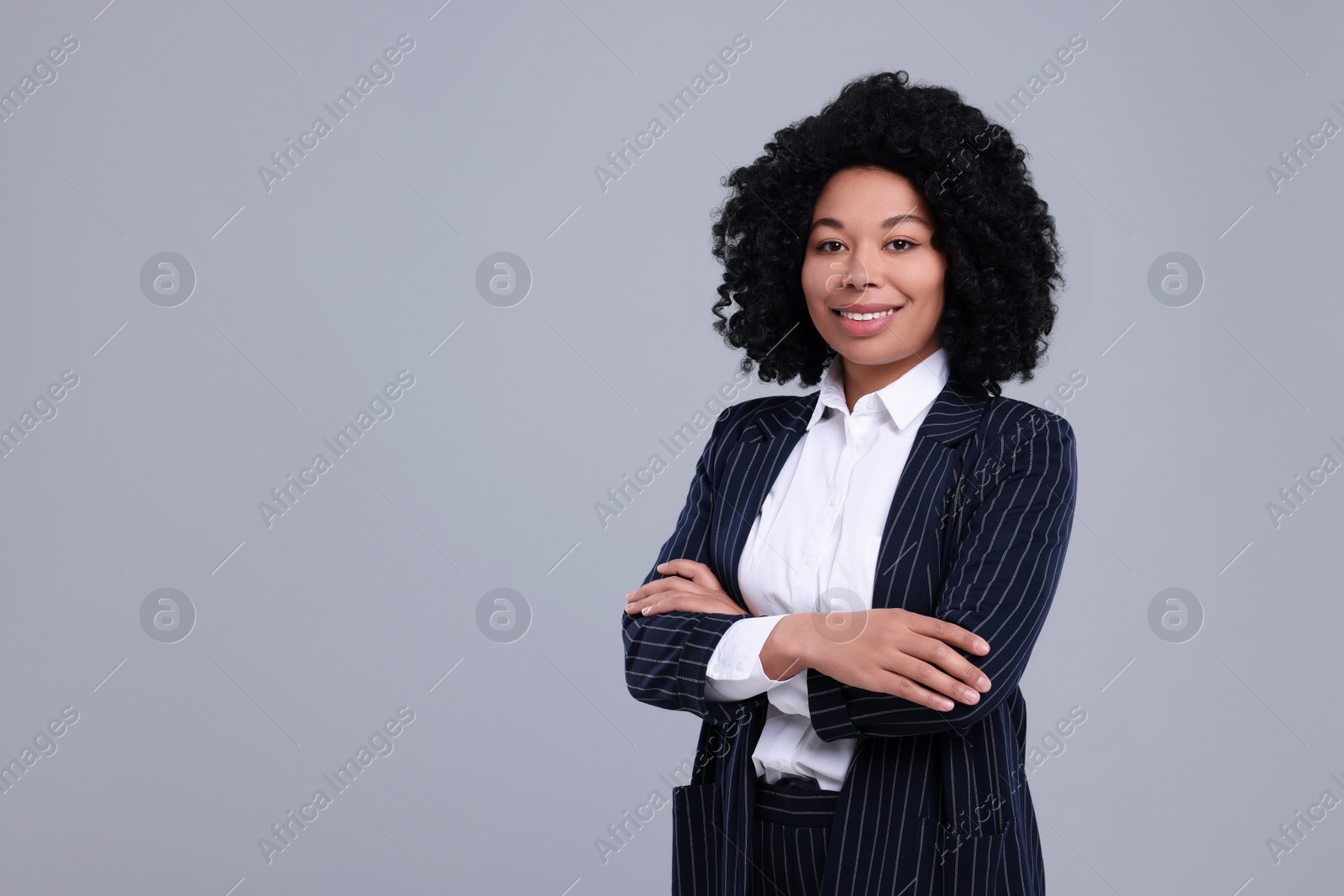 Photo of Young businesswoman in formal outfit on grey background. Space for text