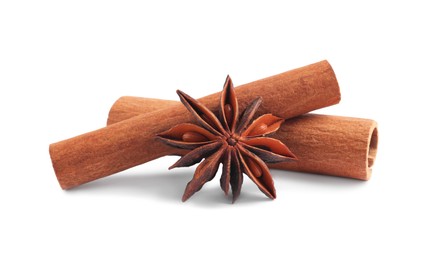 Photo of Aromatic cinnamon sticks and anise star isolated on white