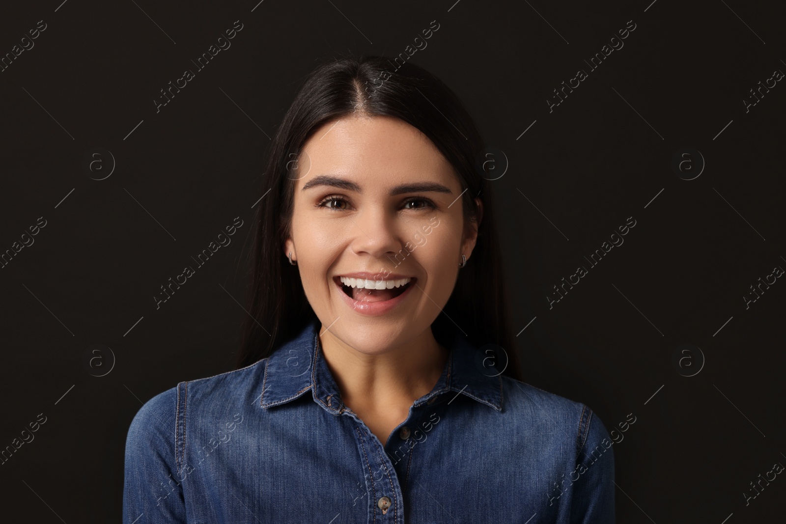 Photo of Personality concept. Emotional woman on black background