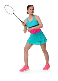 Young woman playing badminton with racket on white background